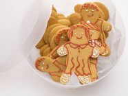 Gingerbread people in container — Stock Photo