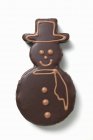 Snowman biscuit with chocolate icing — Stock Photo