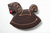 Rocking horse biscuit with chocolate icing — Stock Photo