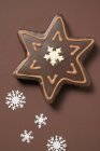 Star-shaped biscuit with chocolate icing — Stock Photo