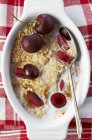 Bowl of oats with milk and cherries — Stock Photo
