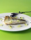 Fried zander with lavender flowers — Stock Photo