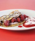 Closeup view of Viennese raspberry omelette on plate — Stock Photo