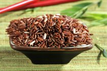 Whole grain red rice — Stock Photo