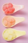Jelly sweets on three spoons — Stock Photo