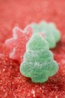 Jelly sweets on red sugar — Stock Photo