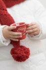 Closeup view of child holding Christmas cup — Stock Photo