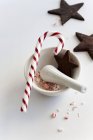 Candy cane in  mortar — Stock Photo