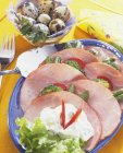 Platter of ham with vegetables — Stock Photo