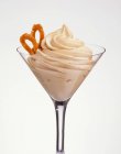 Closeup view of caramel cream with garnish in glass — Stock Photo