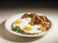 Fried eggs and bacon — Stock Photo