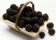 Blackberries in wooden basket — Stock Photo