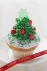 Christmas cupcake with ribbon — Stock Photo