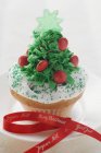 Christmas cupcake with ribbon — Stock Photo