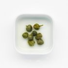Pickled Capers in brine — Stock Photo
