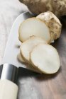 Partly sliced Fresh ginger root — Stock Photo