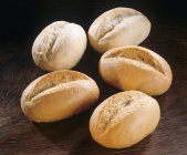 Five fresh bread rolls — Stock Photo