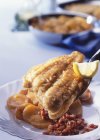 Fried plaice fillets with bacon — Stock Photo
