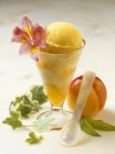 Peach sorbet in glass — Stock Photo