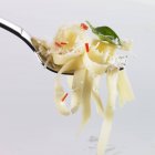 Tagliatelle pasta with chilli and grated Parmesan — Stock Photo