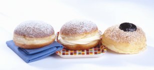 Three doughnuts with jelly — Stock Photo