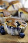 Blueberry muffins on wooden table — Stock Photo