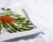Green asparagus with caviar — Stock Photo