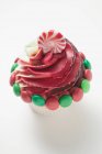 Cupcake decorated with Christmas sweets — Stock Photo