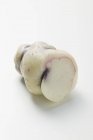 Oca, with a piece cut off  on white background — Stock Photo