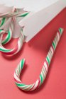 Candy canes in paper bag — Stock Photo