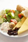 Ploughman's lunch on white plate — Stock Photo