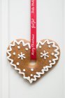 Decorated gingerbread on ribbon — Stock Photo