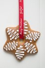 Decorated gingerbread on ribbon — Stock Photo