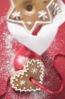 Assorted gingerbread on red background — Stock Photo