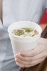 Paper cup of Asian noodle soup — Stock Photo
