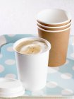 Cappuccino in paper cup — Stock Photo