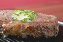 Beef steak with butter — Stock Photo