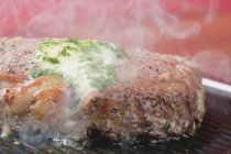 Steaming beef steak — Stock Photo