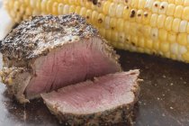 Peppered steak with corn — Stock Photo