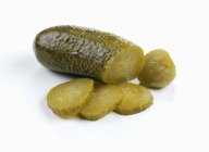 Partly sliced pickled Gherkin — Stock Photo