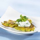 Courgette pancakes with soft cheese — Stock Photo