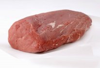 Fresh beef fillet on paper — Stock Photo