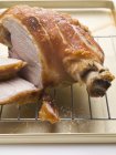 Partly sliced Roasted pork with crackling — Stock Photo