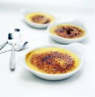 Dishes with creme brulee — Stock Photo