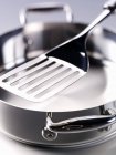 Closeup view of metal pan and spatula — Stock Photo