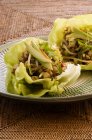 San Choy Bow - avocado and chicken wrapped in lettuce leaves — Stock Photo