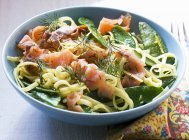 Tagliatelle pasta with smoked salmon — Stock Photo