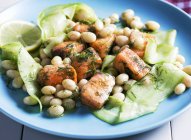 Marinated salmon with cucumber and beans — Stock Photo