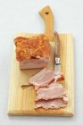 Partly sliced Smoked bacon — Stock Photo