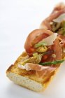 Baguette with ham and vegetables — Stock Photo